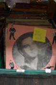 A box of approximately one hundred vintage vinyl albums of mixed genres