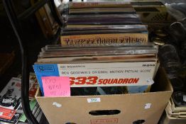 A box of approximately one hundred vintage vinyl albums of mixed genres