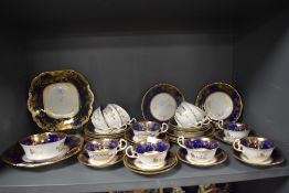 An early 20th century part tea service by Aynsley pat no. 13016 in a cobalt and gilt decoration