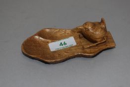 A 20th century Arts and Crafts style Bob Hunter Wren man Yorkshire pin dish bearing typical carved