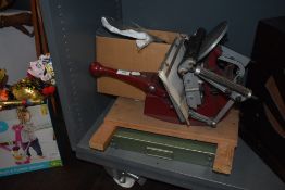A vintage Adana Five - Three typesetting printers machine with a selection of type faces and