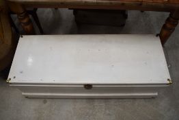 A stained frame bedding chest