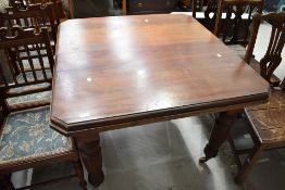 A Victorian mahogany wind out dining table