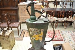A vintage grease can with pump