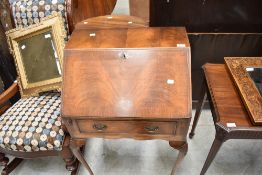 A mid 20th Century walnut bureau in the Queen Anne style