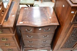 A reproduction Regency style serpentine front bedside chest of four drawers