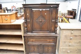 A modern oak court cupboard with drawer and cupboard storage