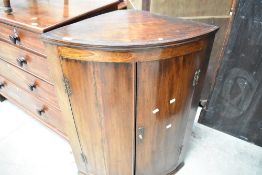 A 19th Century mahogany bow front corner cupboard