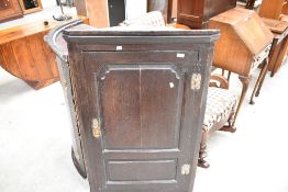 A Period oak panelled corner cupboard