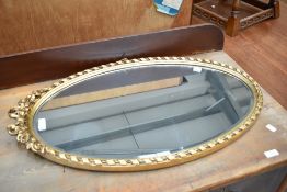 A traditional gilt frame wall mirror