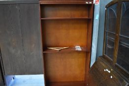 A reproduction mahogany tall bookcase, height approx. 194cm