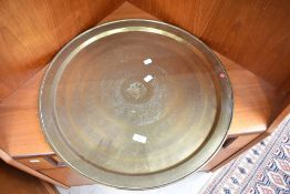 A large brass Eastern tray having Egyptian style decoration