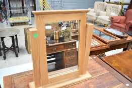 A modern oak dressing table mirror