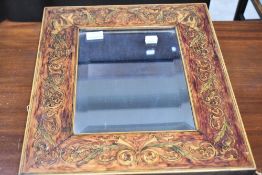 A period style wall mirror having painted cherub decoration
