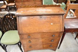 An Edwardian Bureau with three drawer set in oak