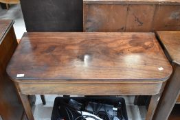 A Georgian mahogany fold over tea table