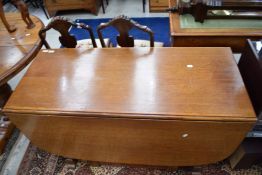A vintage oak gateleg dining table