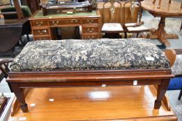 A stained frame footstool