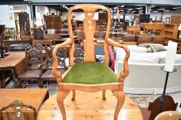 A stained frame arm chair in the Queen Anne style