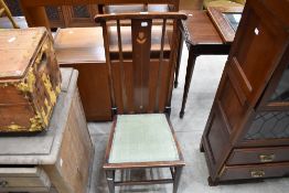 An Art Nouveau mahogany high back salon chair