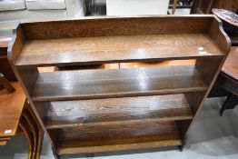 An Arts and Crafts oak bookshelf having exposed pegged joints