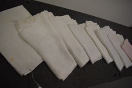 A collection of antique and vintage damask table cloths, some good sizes amongst this collection.