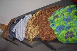 Six ladies vintage tops and blouses in vibrant patterns.