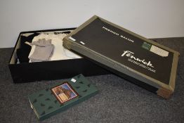 A vintage advertising box for Fenwick, containing a pair of gents button fly trousers, two waist