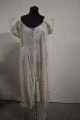 A Rare Victorian ladies all in one cotton split leg undergarment with button fastening and pretty