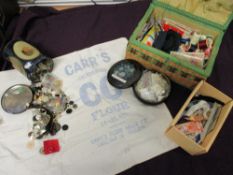 A mixed lot of haberdashery, including buttons, fastenings, thread and similar, sold alongside a