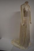A 1940s 'Double eleven/ dinner plate label' utillity labelled bias cut wedding dress having