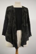 An Art Deco top or bodice having extensive bead work,silk lining, fluted sleeves and integrated