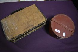 A vintage embossed leather bag having Egyptian scenes, internal compartments and pockets and