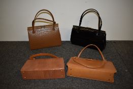 Four vintage framed box bags, including black patent bag.