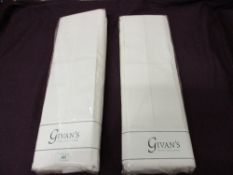 Two Givans Irish linen stores king size sheets in packaging.