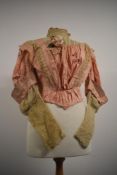 A Victorian pale pink shot silk and tulle boned bodice having high neckline and puff sleeves.