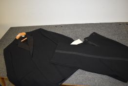 A gents vintage Burberrys suit, consisting of jacket and trousers with button fly fastening.