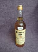 A bottle of Highland Mist Blended Scotch Whisky, 25FL.0zs, 65.5 %, under proof, having gold coloured