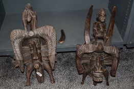 Two African carved tribal wood masks in traditional designs both approx 50cm long