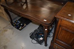 A traditional oak drawer leaf table in the French provincial style