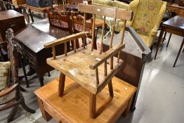 A rustic elm armchair in a provincial Irish style design, Having historical worm