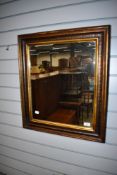 A 19th Century wall mirror having foliate and gilt decoration