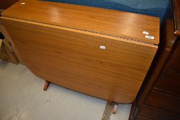 A vintage laminate gateleg kitchen table