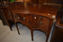 A Regency mahogany serpentine fronted sideboard , locks stamped London