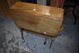 An Edwardian mahogany drop leaf occasional table