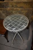 A modern metal and glass conservatory side table