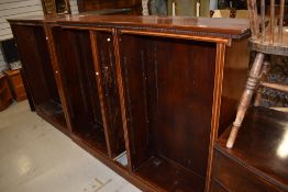 A run of Edwardian mahogany bookshelf parts, with line inlaid decoration