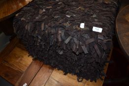 A scrap leather pouffe