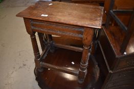 A traditional oak coffin style stool/side table