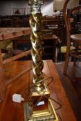 A brass table lamp of twist design
